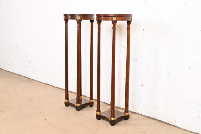 baker furniture regency mahogany and brass pedestal plant stands pair 2504