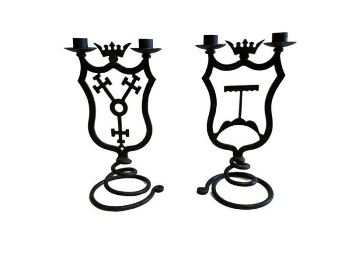 black wrought iron candleholders with coats of arms set of 2 1