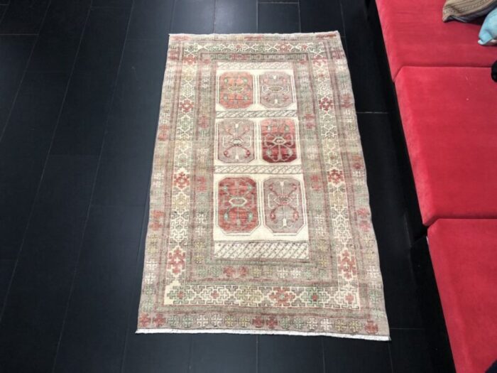 hand knotted faded wool rug 2