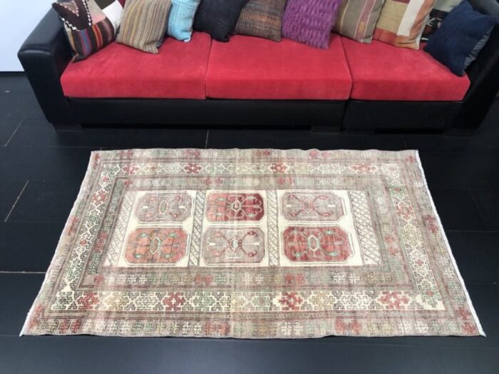 hand knotted faded wool rug 4