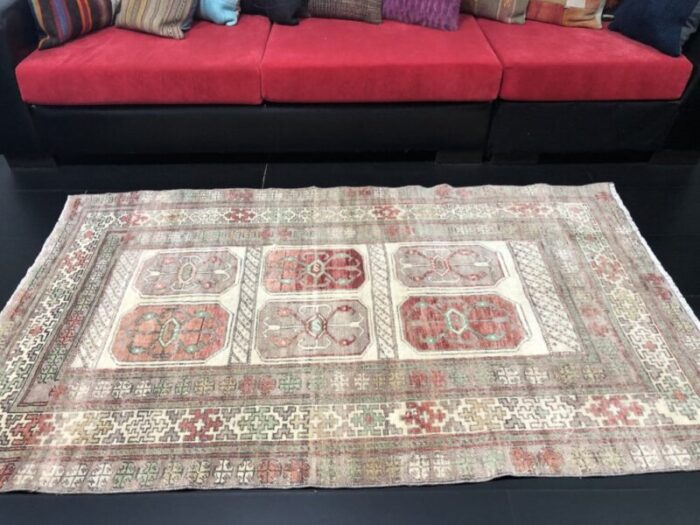 hand knotted faded wool rug 5