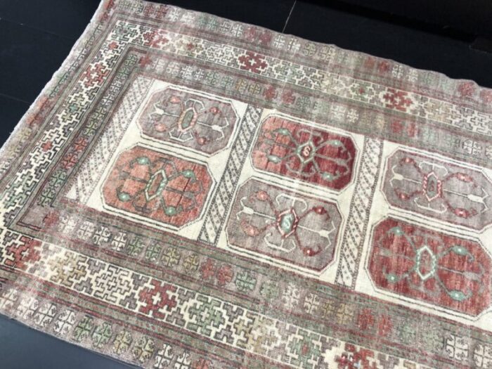 hand knotted faded wool rug 8