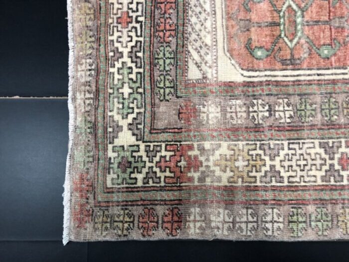 hand knotted faded wool rug 9