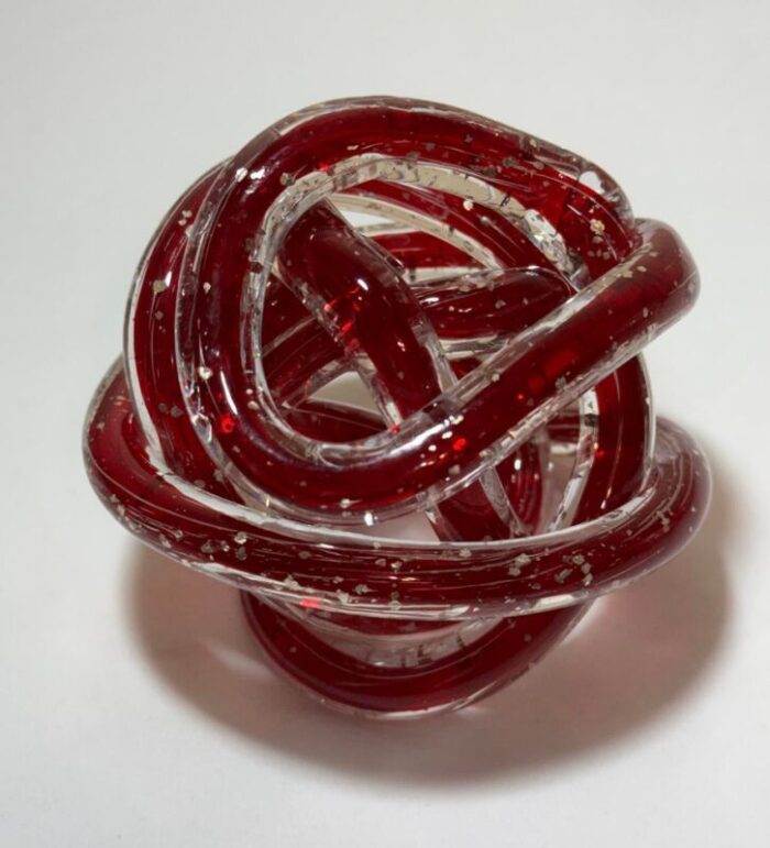 late 20th century red art glass twisted knot orbit ball aventurine metallic gold flecks 3429