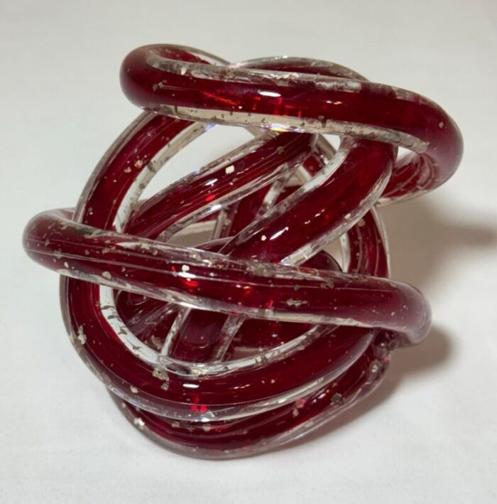 late 20th century red art glass twisted knot orbit ball aventurine metallic gold flecks 3436