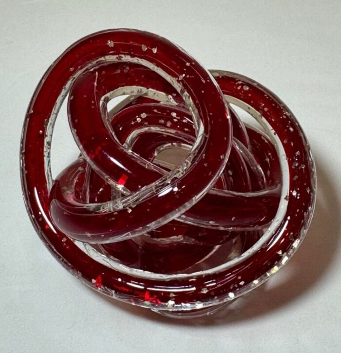 late 20th century red art glass twisted knot orbit ball aventurine metallic gold flecks 5134