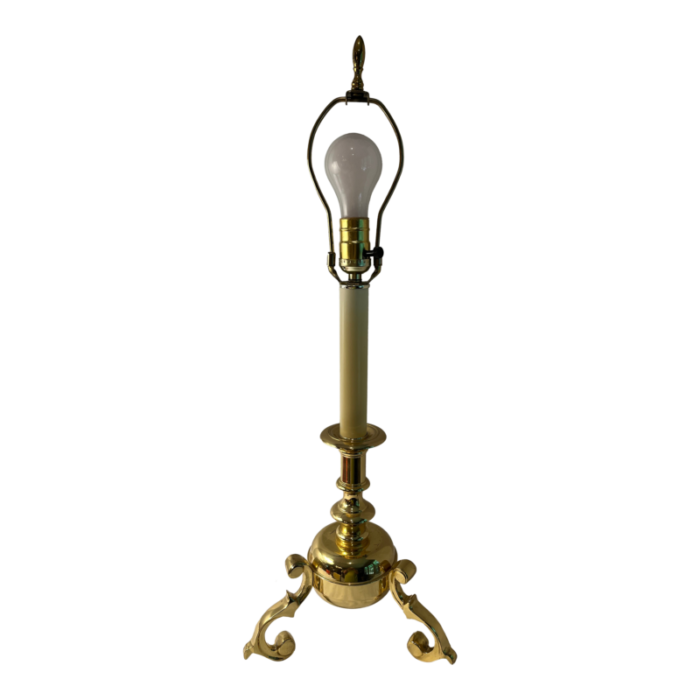 late 20th century tri footed brass lamp 1898