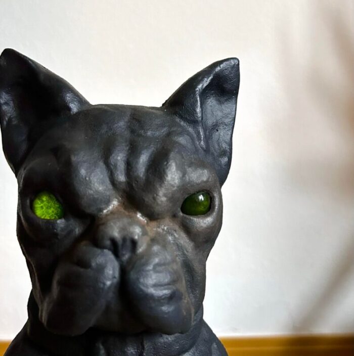 pair of early 20th century cast iron french bulldog andirons with green glass eyes 6033