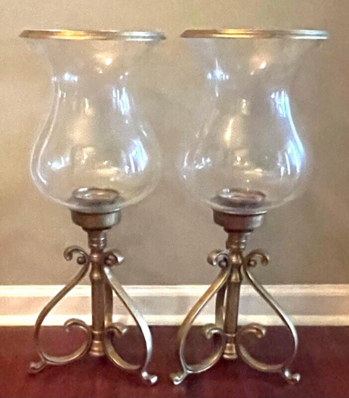 pair of vintage castilian hand blown glass hurricanes and solid brass scrolled base candle holders 5338