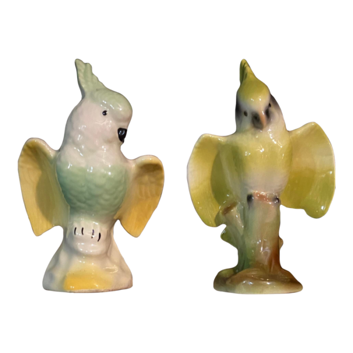 set of two mid 20th century cockatoos crested parrot bird figurines in pastel yellow green brown 3638