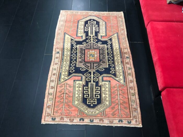 vintage rug in faded coral and navy blue 1