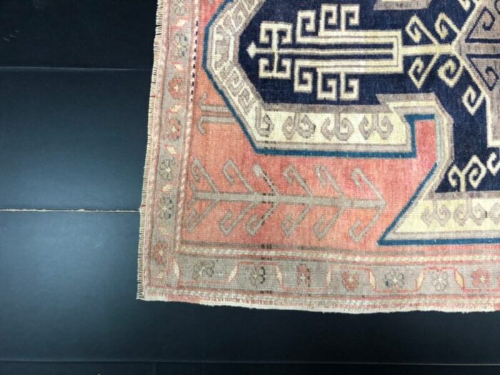 vintage rug in faded coral and navy blue 10