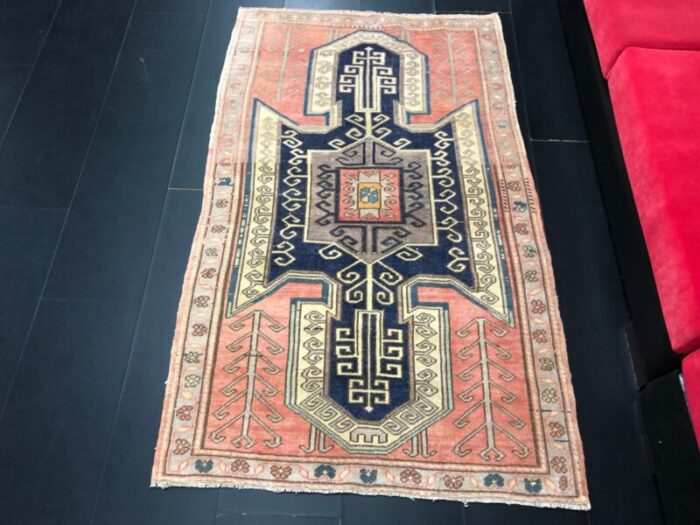 vintage rug in faded coral and navy blue 2