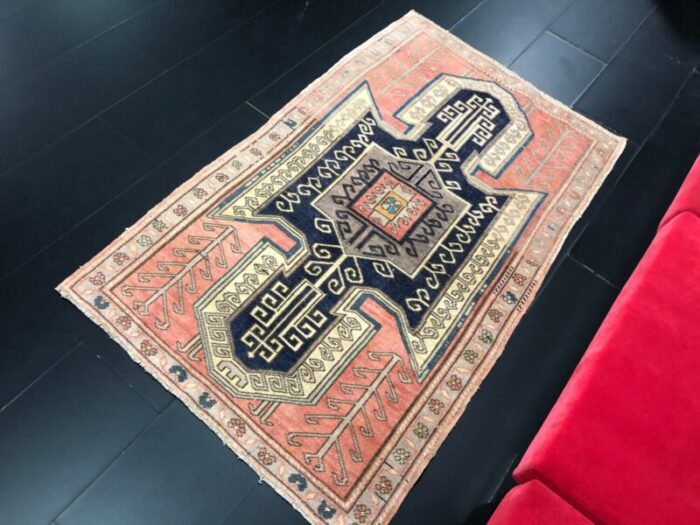 vintage rug in faded coral and navy blue 4