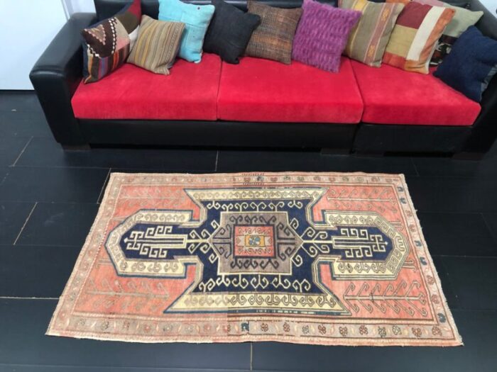 vintage rug in faded coral and navy blue 5