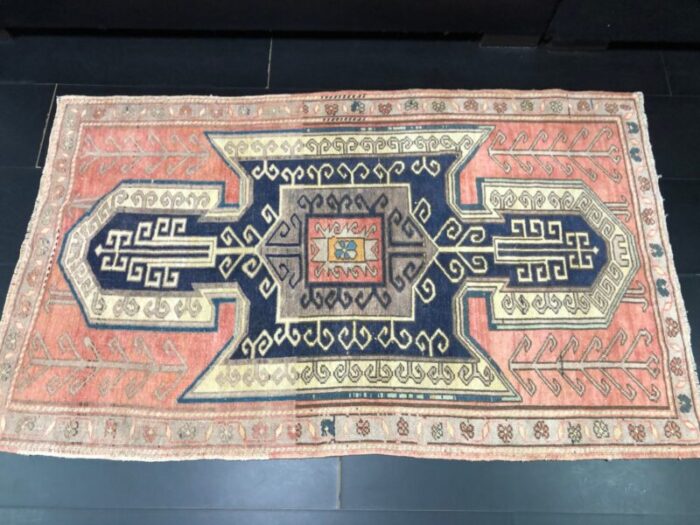 vintage rug in faded coral and navy blue 6