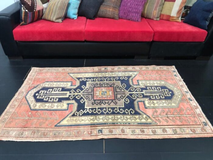 vintage rug in faded coral and navy blue 7