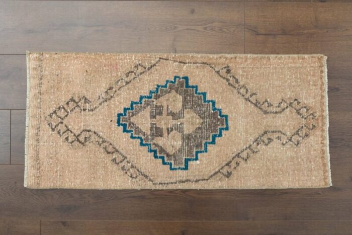 vintage turkish faded orange rug 1