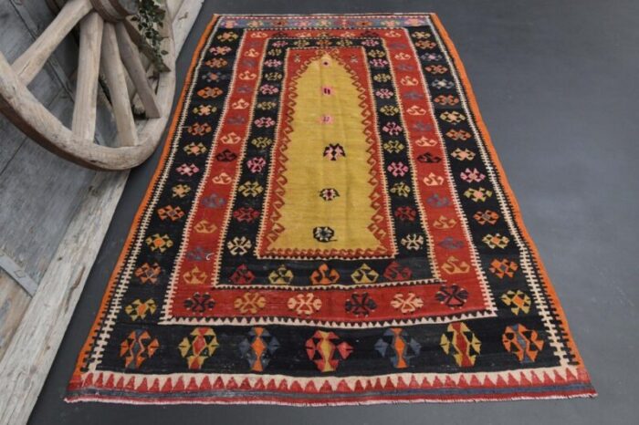 vintage turkish red and yellow area rug 1