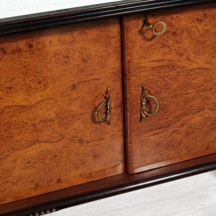 vintage wooden sideboard with decorated glass top and bar compartment 0366