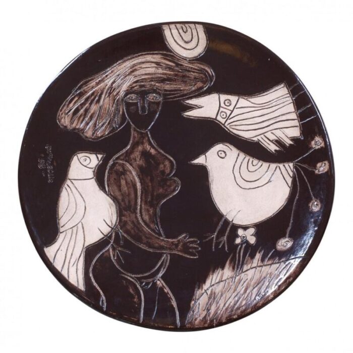 woman with a bird ceramic dish by corneille 1